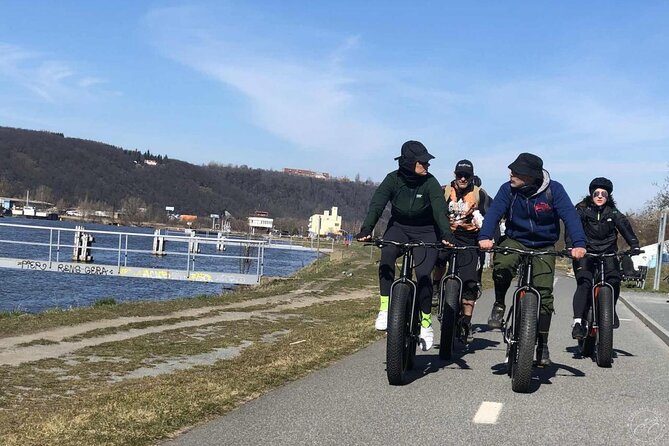FAT TIRE E-BIKE GREAT TOUR - river, parks & panoramic views tour - Lennonova zeď to Charles Bridge: street art meets postcard Prague