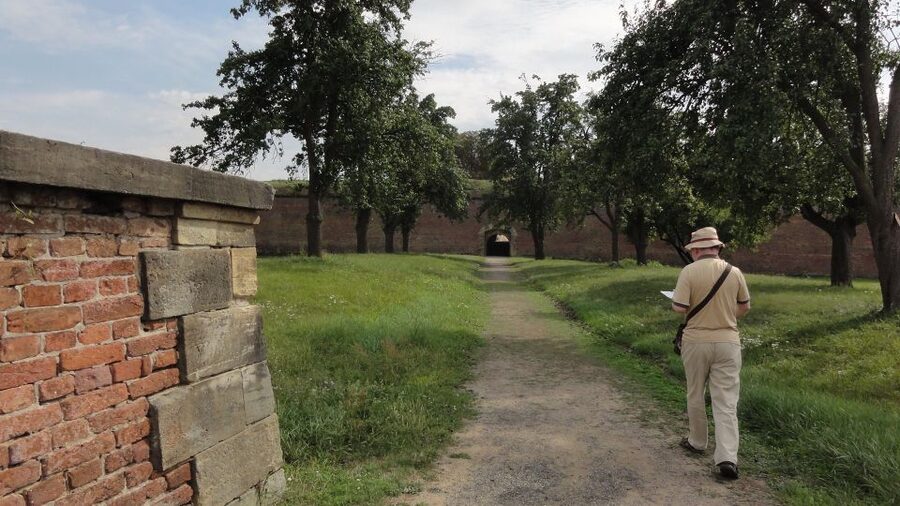 From Prague: Terezin Concentration Camp Private Tour - The meaning of the gate: ARBEIT MACHT FREI and your first walk through the prison world