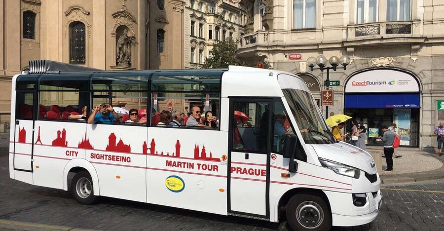 Prague City: 1-Hour Orientation Tour by Bus - Heading into New Town under Charles IV