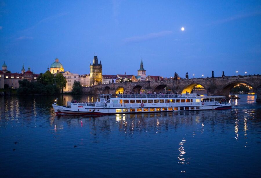 Prague: City Tour and Dinner Cruise with Hotel Pickup - Crossing Over to the Vltava: Boarding the Boat, Welcome Drink, and Buffet Dinner