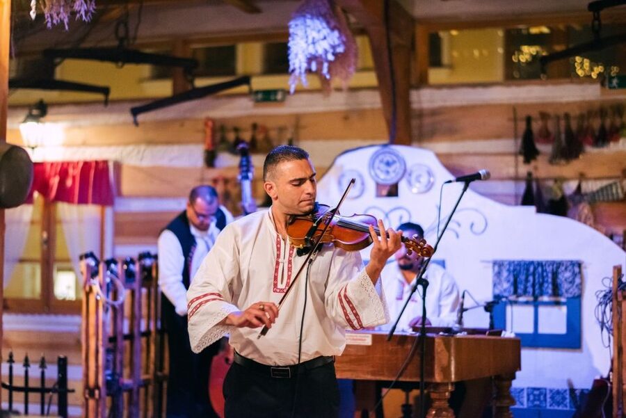 Prague: Evening Folklore Garden Party with Traditional Menu - Dinner setup: 4 courses, served family-style