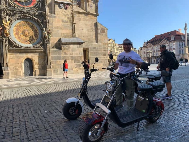 Prague: Guided Fat Tire e-Scooter Tour - Petrin Park descent, the narrow street moment, and Charles Bridge