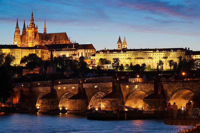 Prague Castle and Charles Bridge above the Vltava at dusk