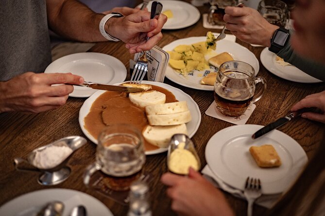 Prague Snack & Stroll: Private Food Tour with Your Local Buddy - Karlín Square: flood history, then a hip food scene