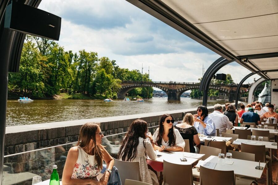 Prague: Vltava River Lunch Cruise in an Open-Top Glass Boat - Lunch onboard: buffet, aperitif, and how to stay comfortable